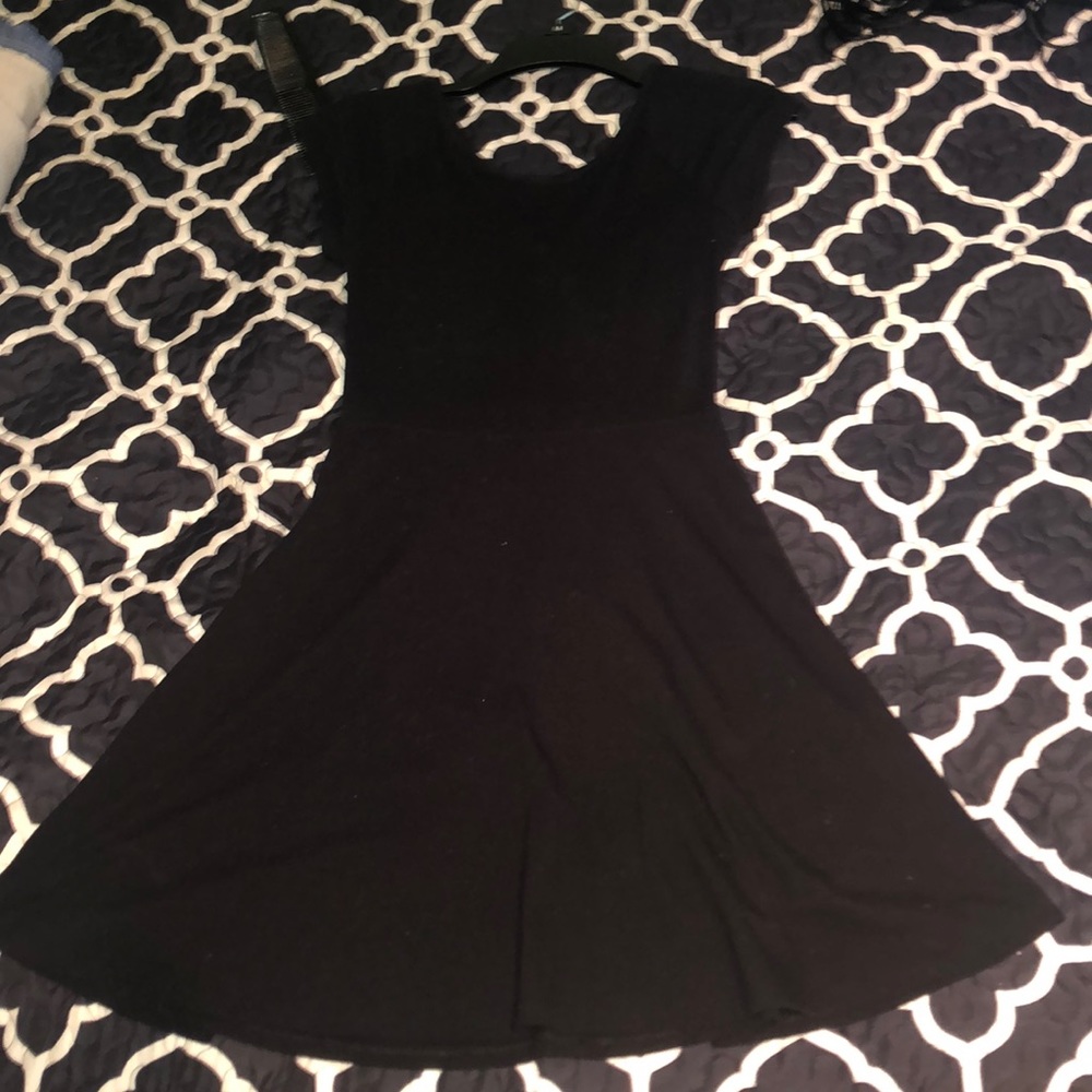 black dress , small hole in back, below bra strap